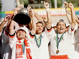 Peter Nowak and teammates hoist the Alan I. Rothenberg Trophy